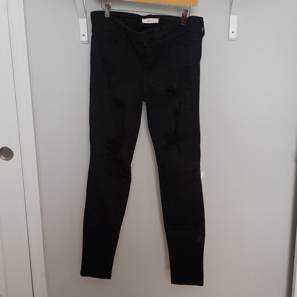 Super distressed black jeans